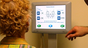 During a recent in service training at Ministry Good Samaritan Health Center, Miira Allen, physical therapist, Ministry Good Samaritan Health Center, left, and Mario Bertosa, Rehabilitation Product Sales, Lifetech, Inc., work with the BioSway equipment.